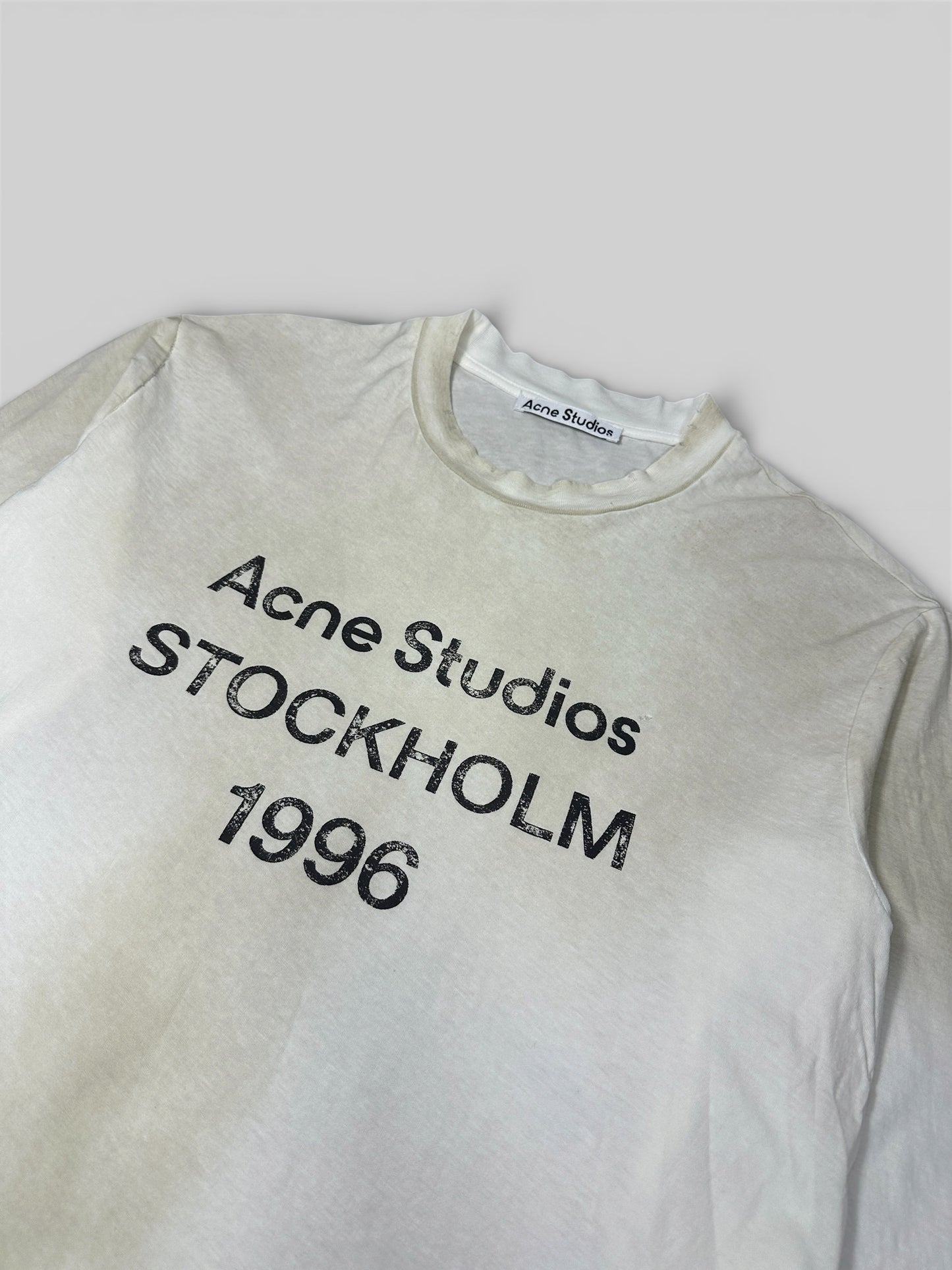 Acne Studios 1996 shirt branding detail — FashnLuxe