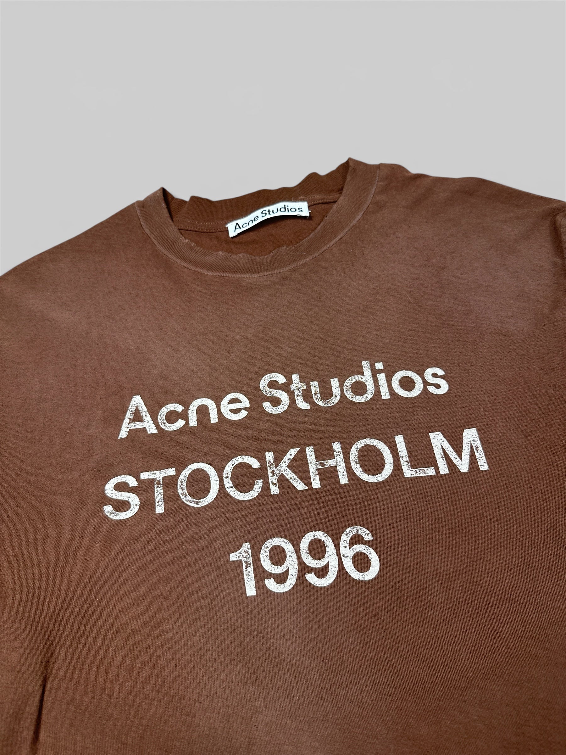 Acne Studios 1996 shirt branding detail — FashnLuxe