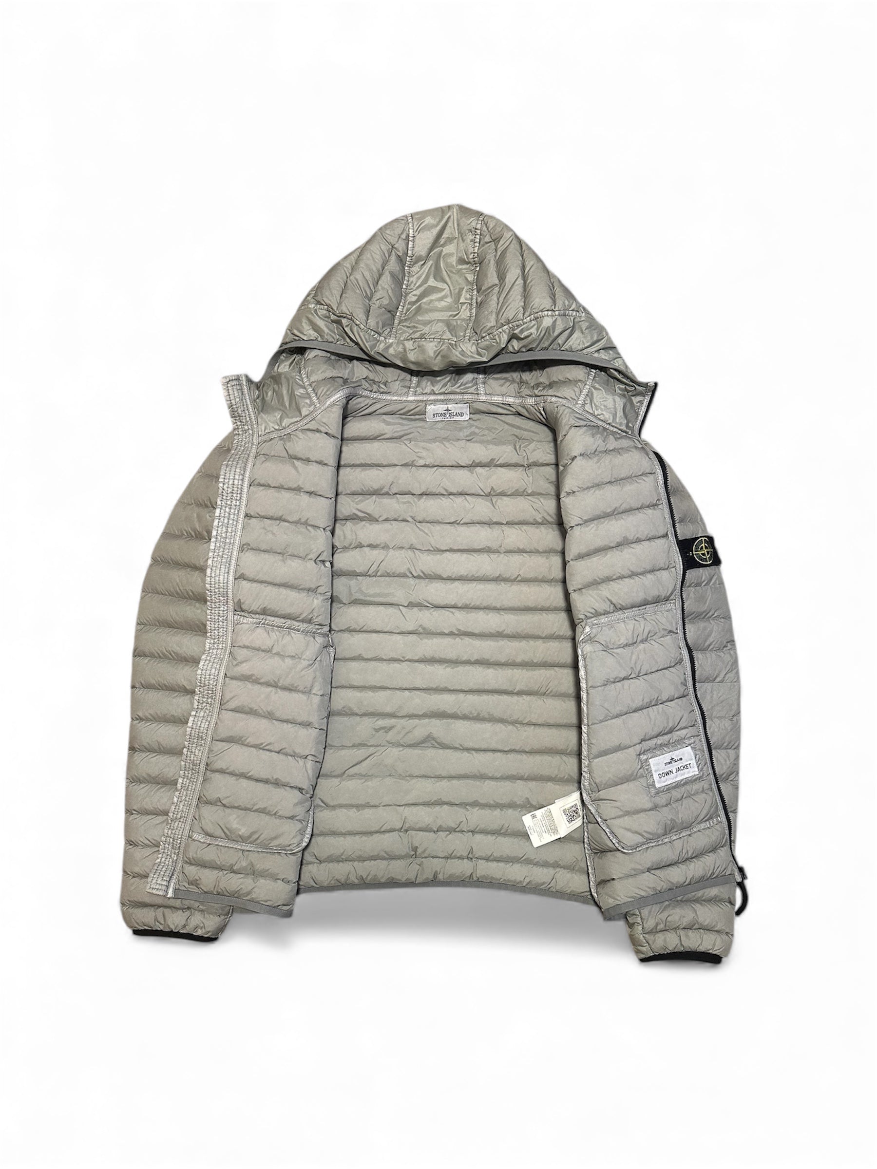 Stone Island down jacket compass badge detail — FashnLuxe