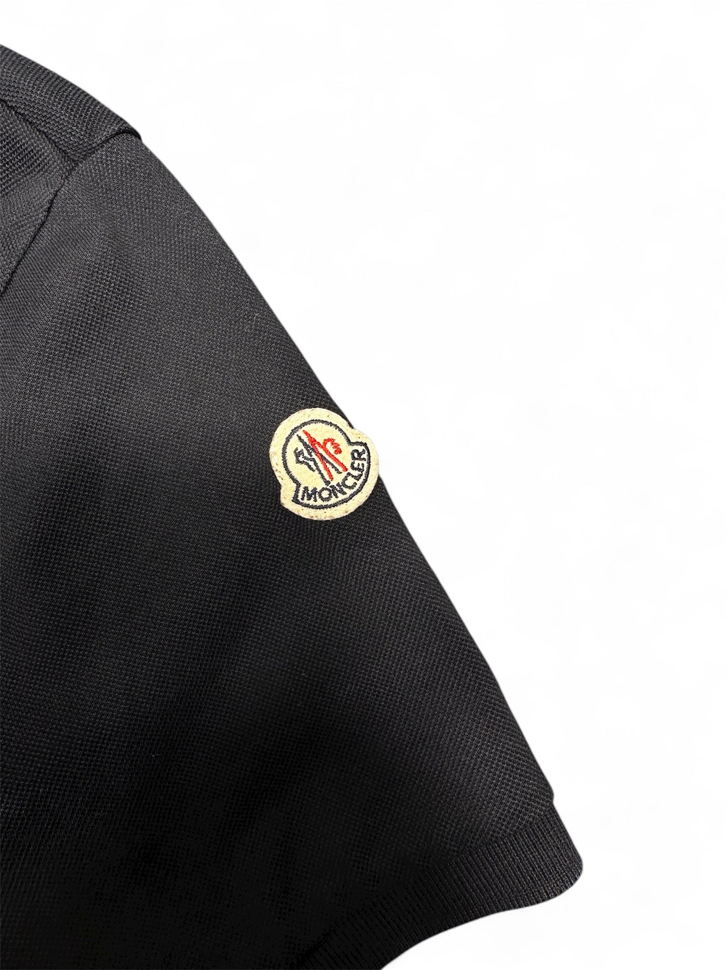 Moncler polo logo embroidery detail — FashnLuxe