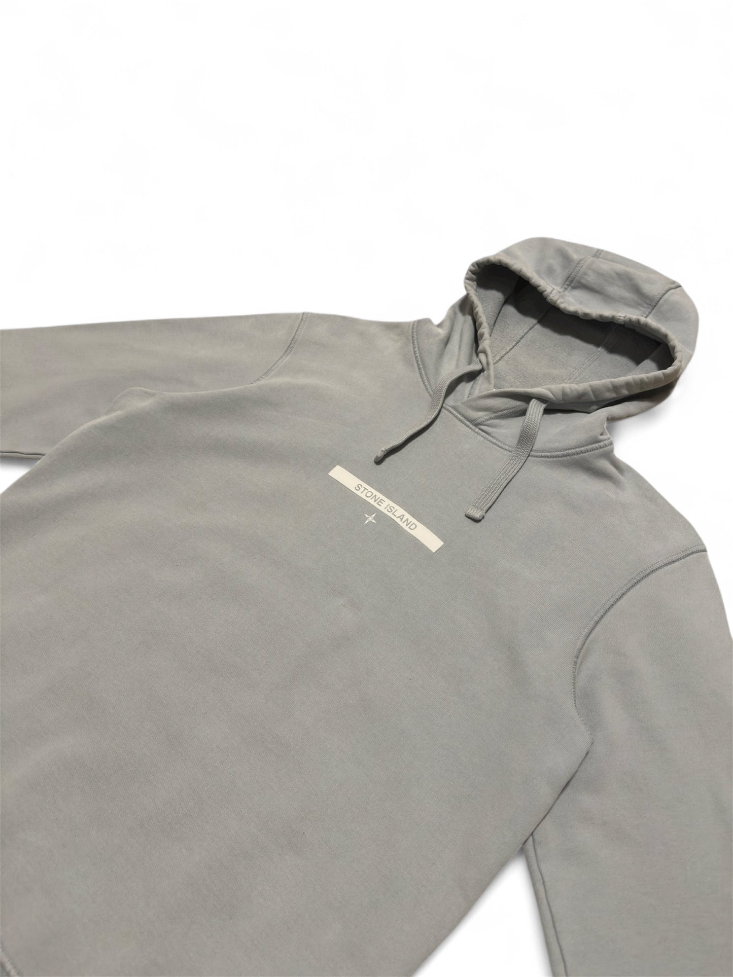 Stone Island hoodie badge detail close-up — FashnLuxe