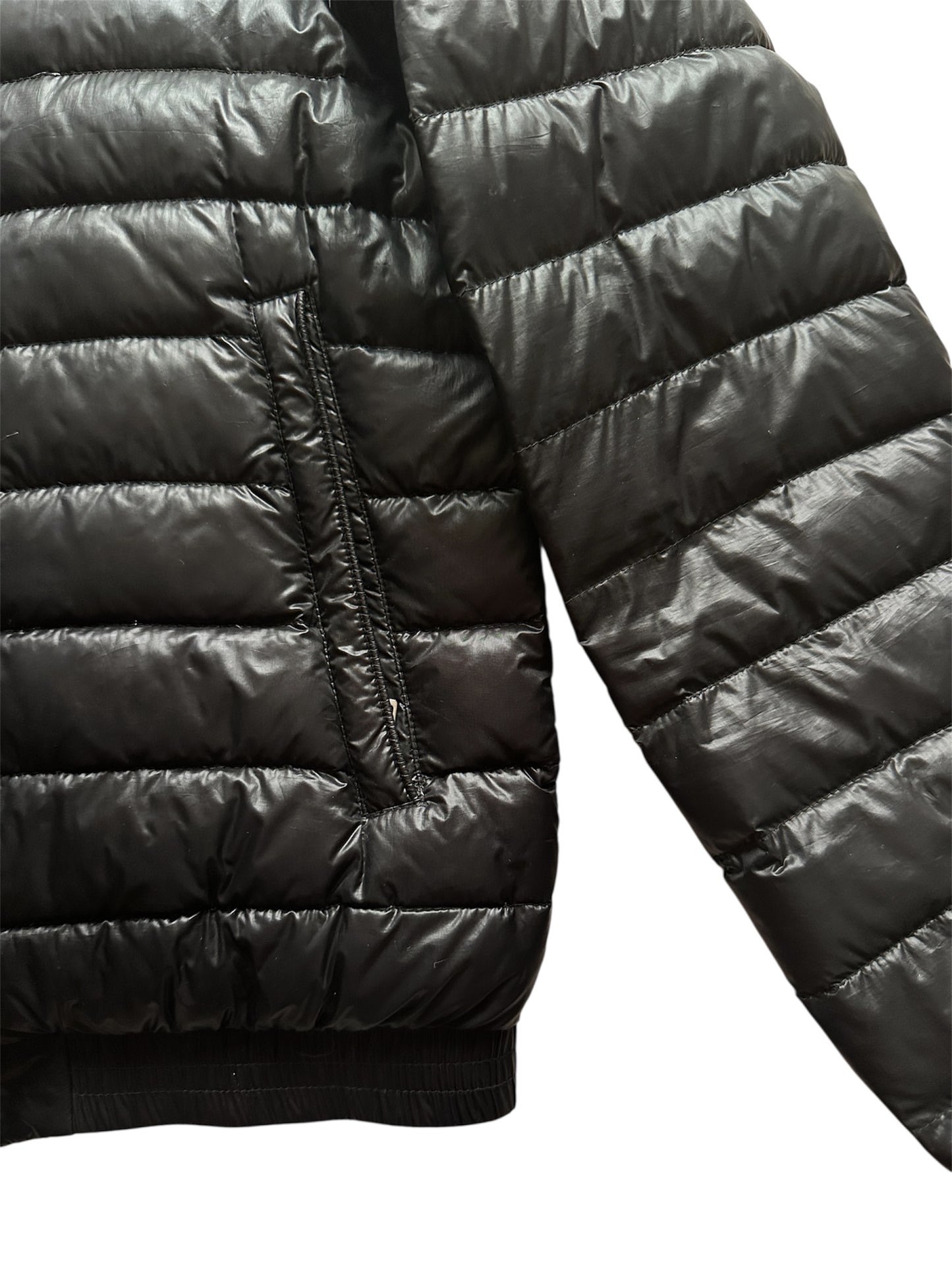Moncler down jacket sleeve and badge — FashnLuxe