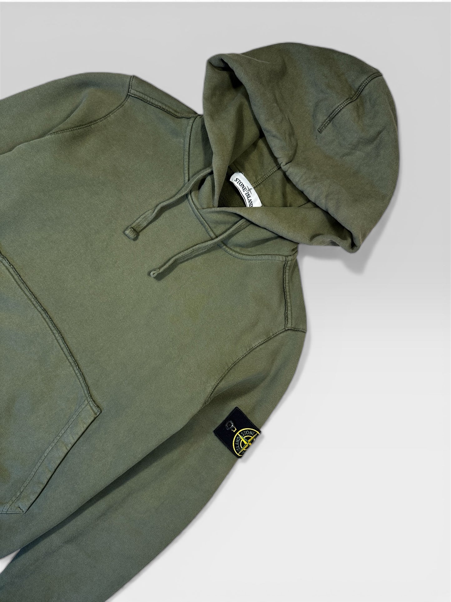 Stone Island hoodie badge close-up — FashnLuxe