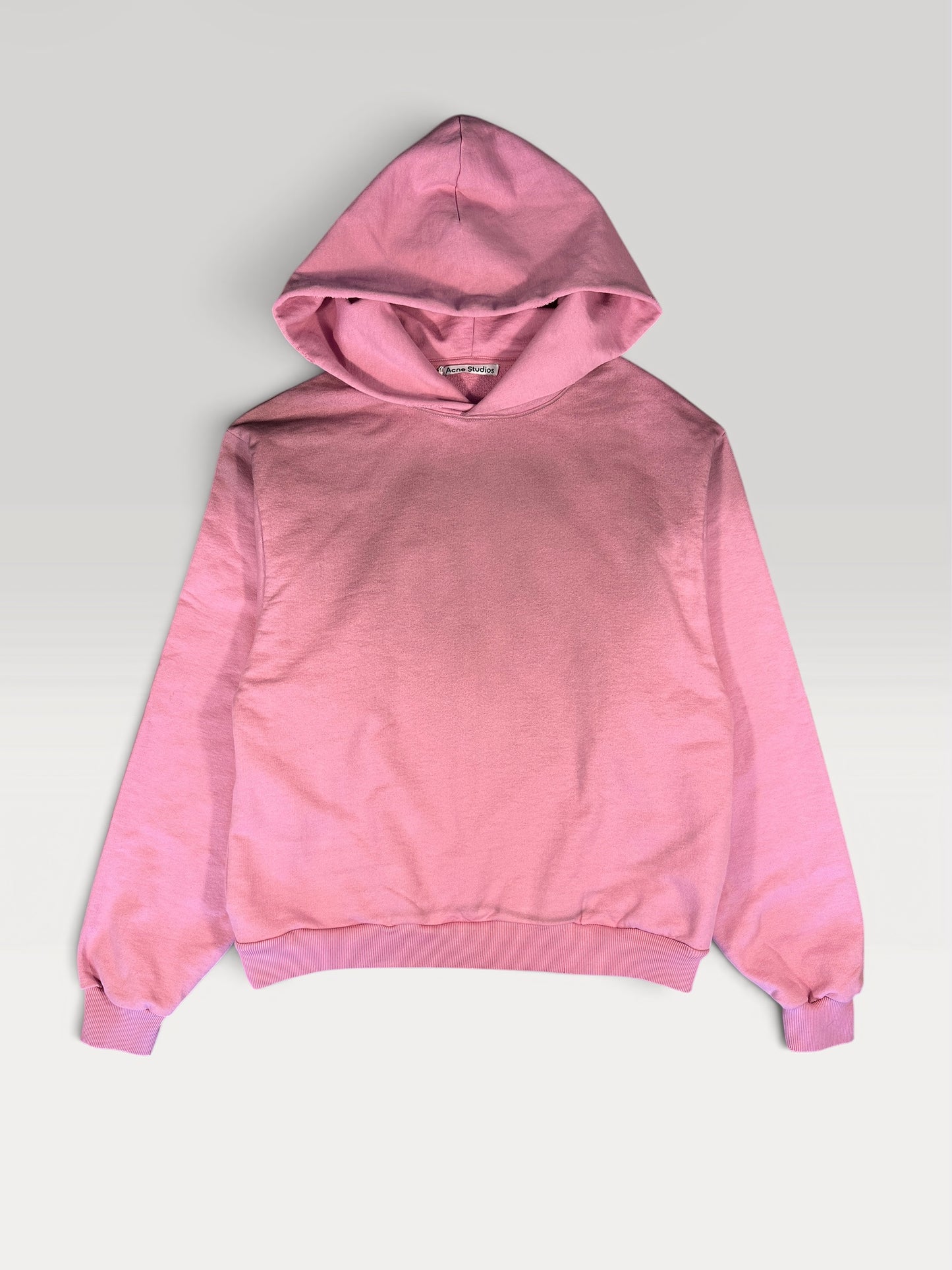 Acne Studios 1996 hoodie in faded pink, front view with clean blank chest