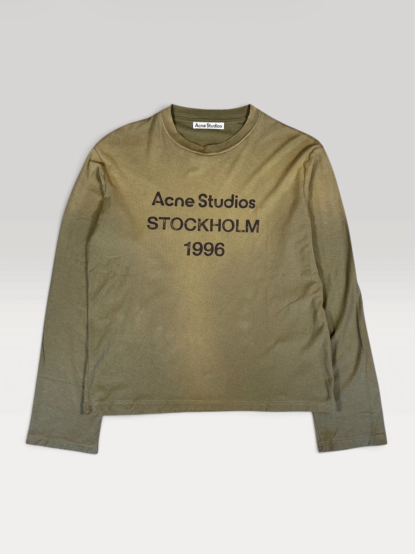 Acne Studios 1996 longsleeve in faded olive, front view with chest logo print