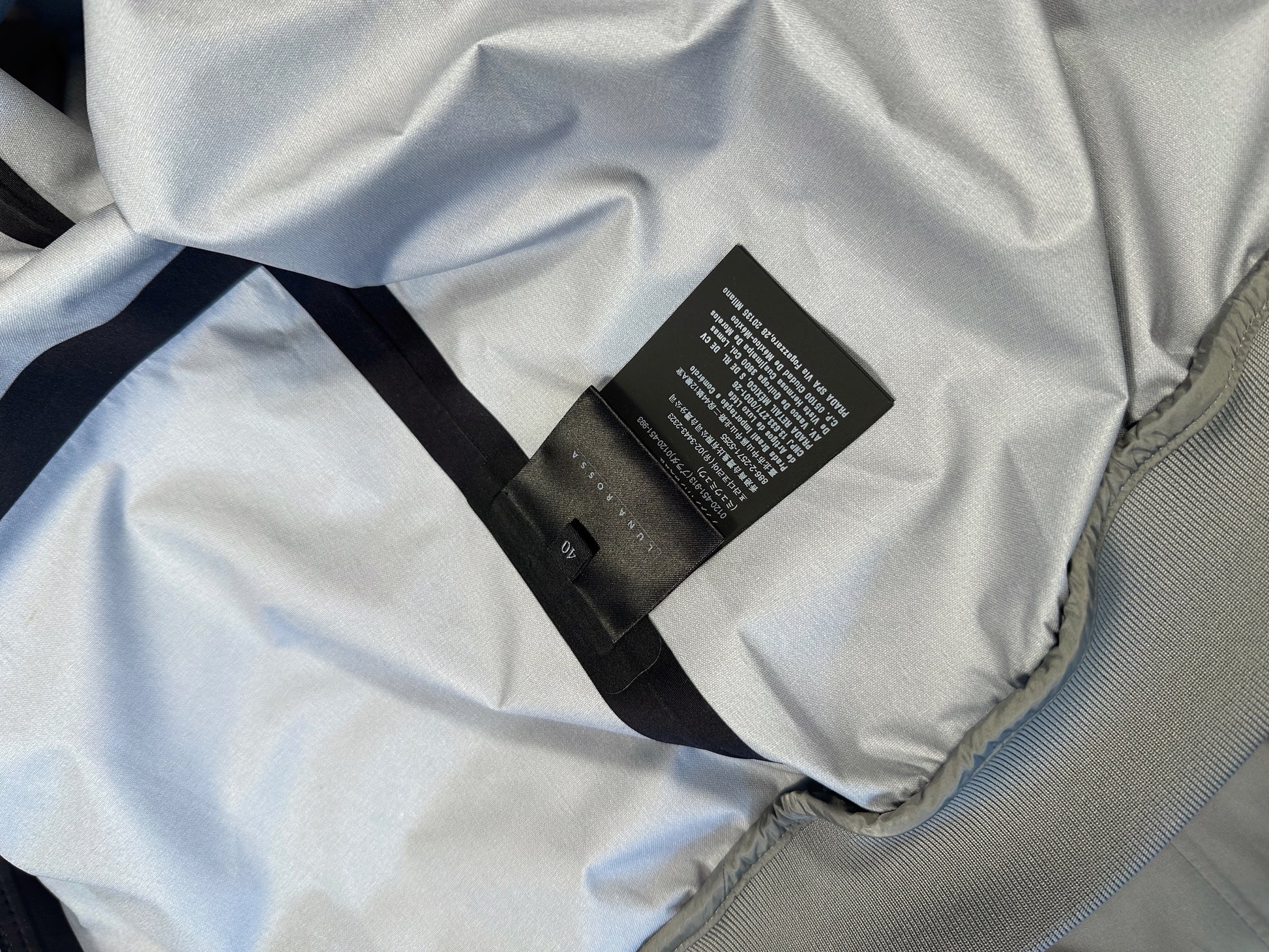 Prada Luna Rossa care and size label showing size 40